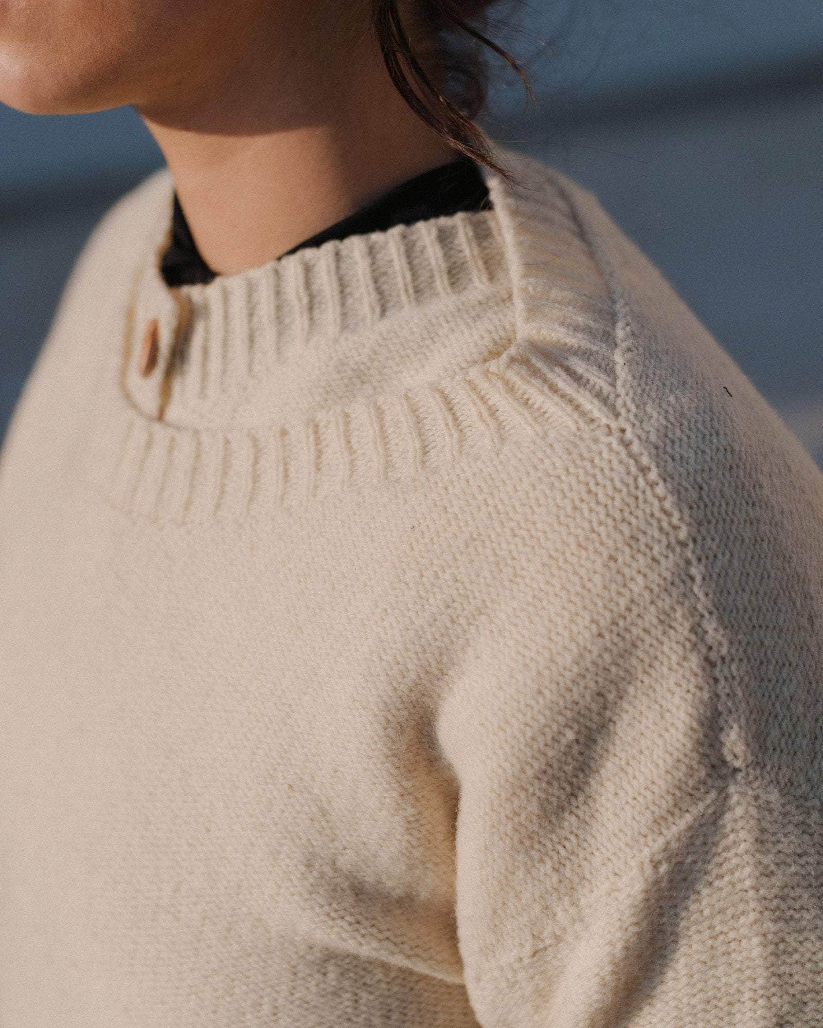 BASERANGE KNITTED TIER SWEATER