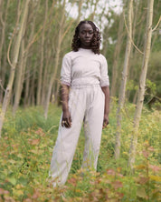 BASERANGE WOVEN LONG SLEEVE APRON TOP