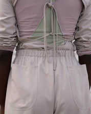 BASERANGE WOVEN LONG SLEEVE APRON TOP