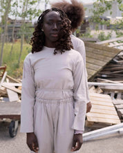 BASERANGE WOVEN LONG SLEEVE APRON TOP