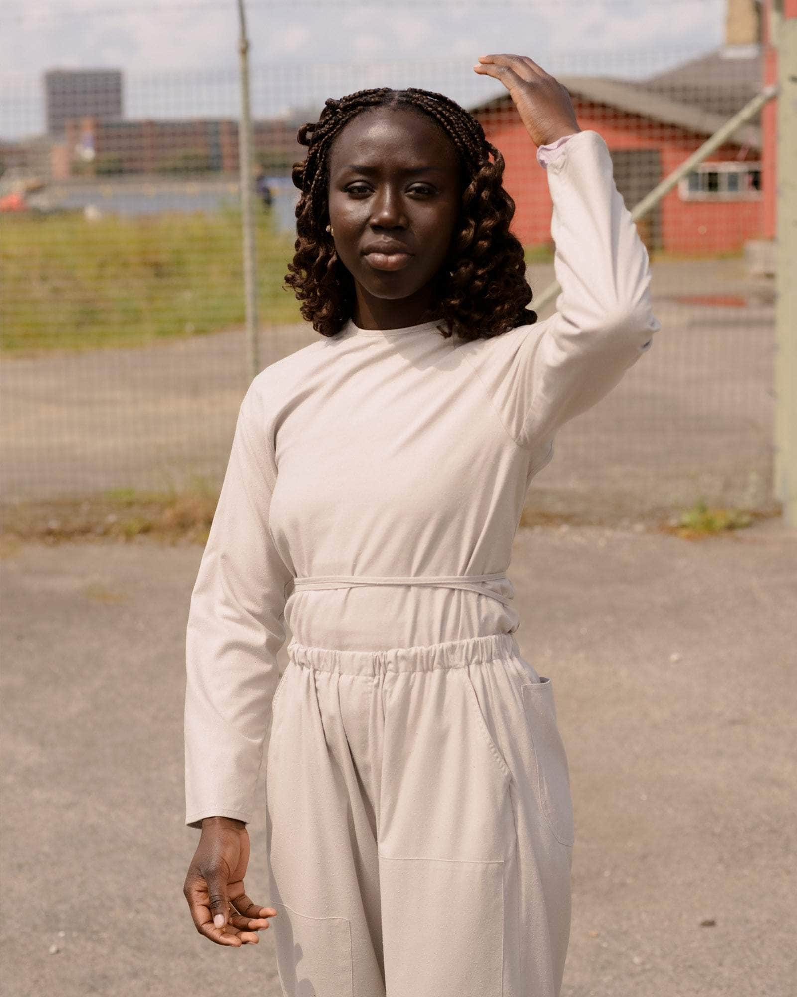 BASERANGE WOVEN LONG SLEEVE APRON TOP