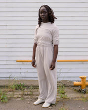 BASERANGE WOVEN LONG SLEEVE APRON TOP