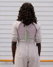 BASERANGE WOVEN LONG SLEEVE APRON TOP