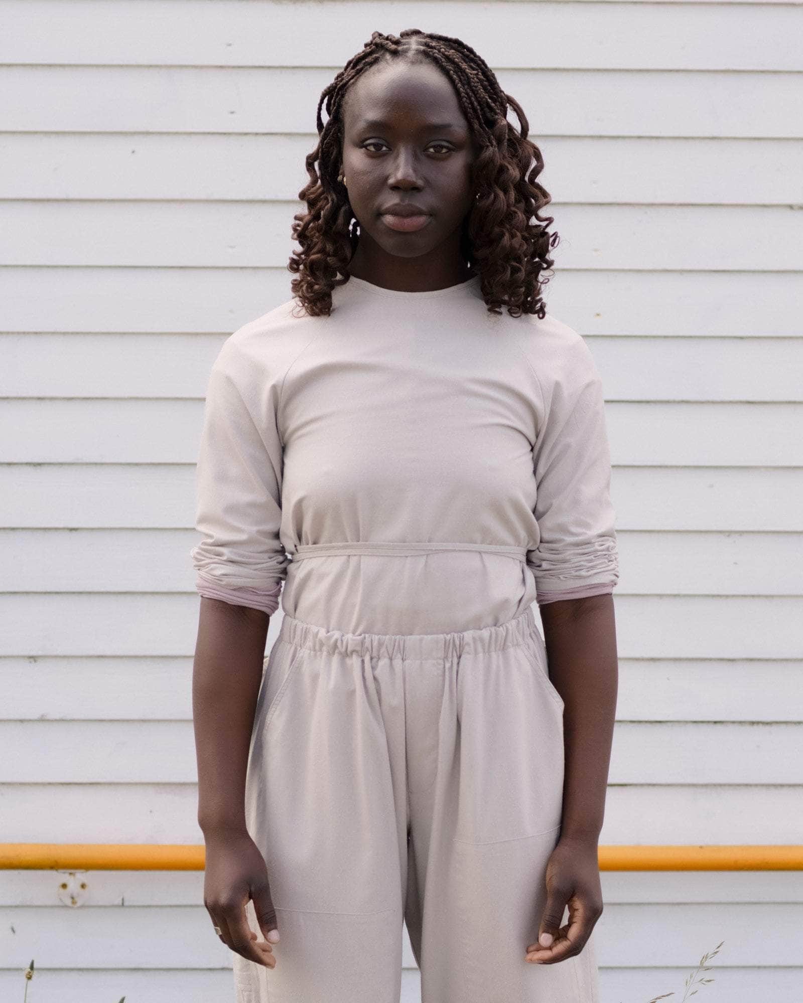 BASERANGE WOVEN LONG SLEEVE APRON TOP