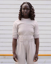 BASERANGE WOVEN LONG SLEEVE APRON TOP