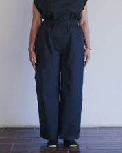 BASERANGE WOVEN PART PANTS